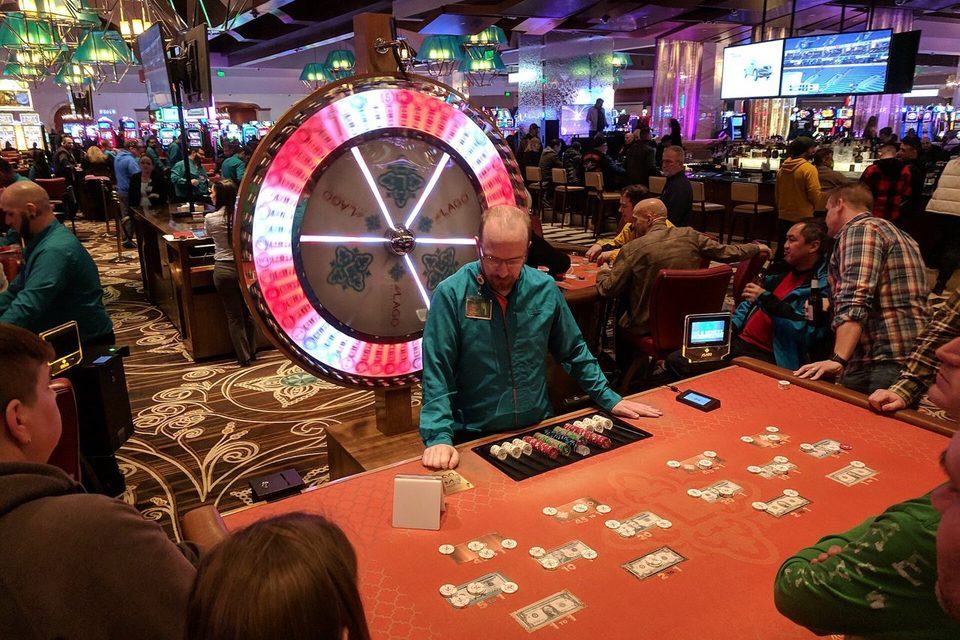 A Big Six money wheel mounted above a gaming table in a casino
