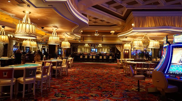 Casino gaming floor with tables and chandeliers