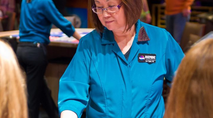Dealer running a table game in a casino